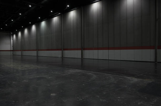 istock Gray big clean empty industrial hall as warehouse or office space 672895528