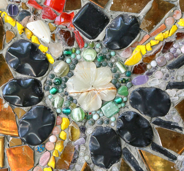 istock Colorful ceramic pattern decoration with pebbles made from pebble and ceramic on the wall. 672898552