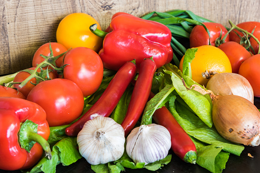 Assorted group of vegetables on a dark kitchen table