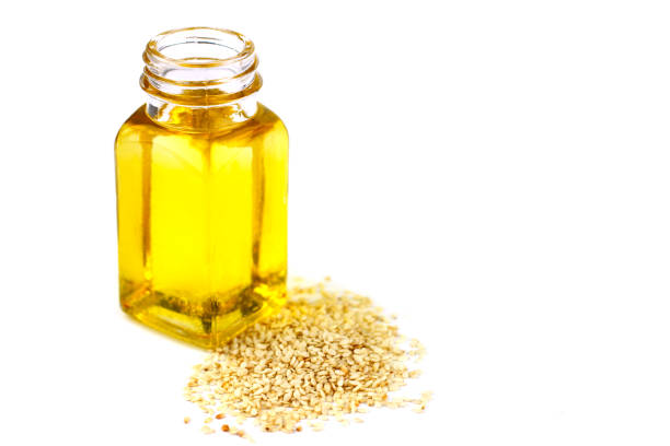 istock Sesame oil isolated on white background 672901490