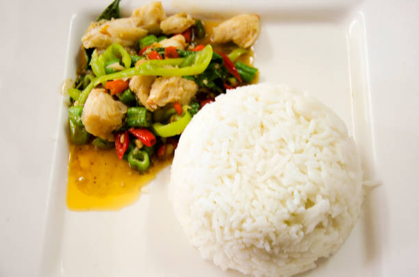 istock Rice topped with stir-fried meat crab mix chilli and Basil leaves 672905186