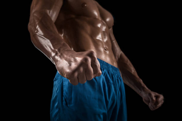 istock Part of a man's body on a dark background with copyspace 672906110