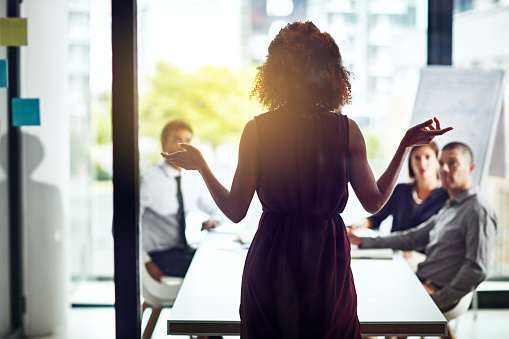 Shot of a group of colleagues having a meeting in a modern office