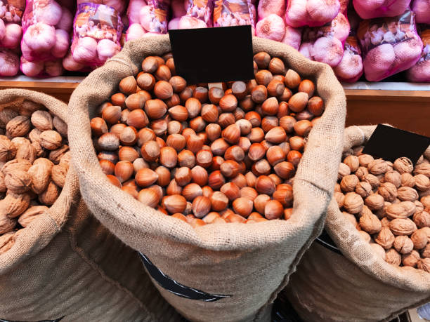 Hazelnuts A big bag with hazelnuts tienda stock pictures, royalty-free photos & images