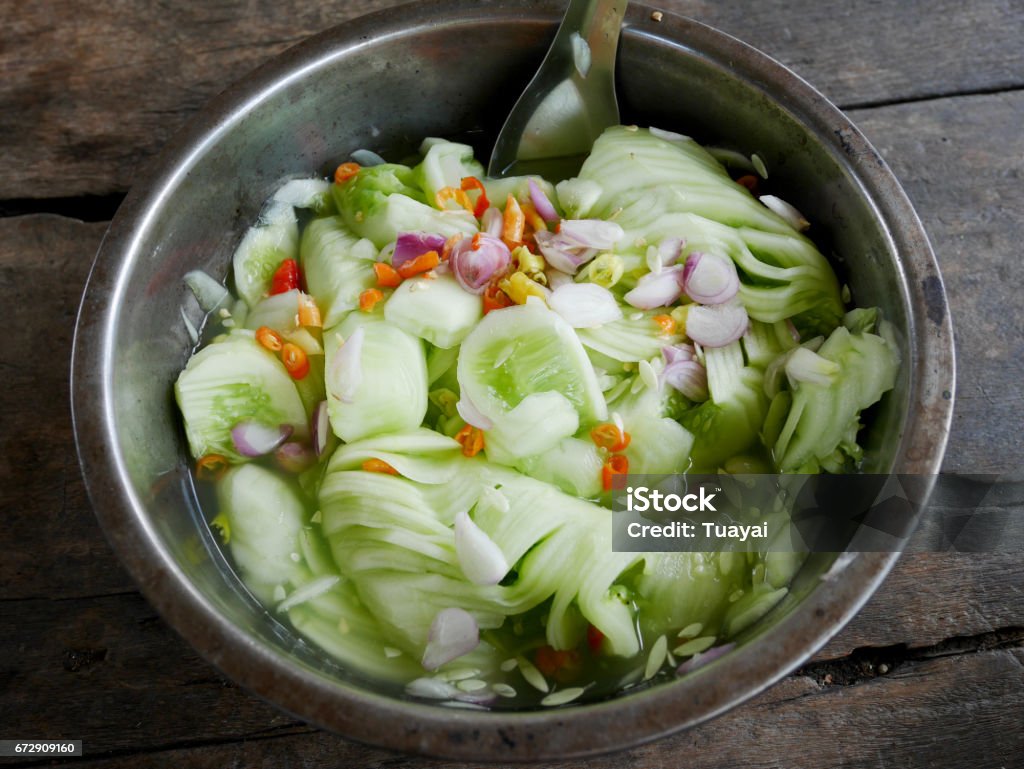 Acar or achat served as a side dish with the thai food Acar or achat It is made with cucumber, red chilies, red onions or shallots, vinegar, sugar and salt. It is served as a side dish with the thai food Appetizer Stock Photo