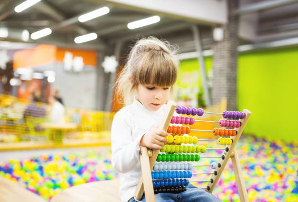 istock Little girl playing on playground 672909832