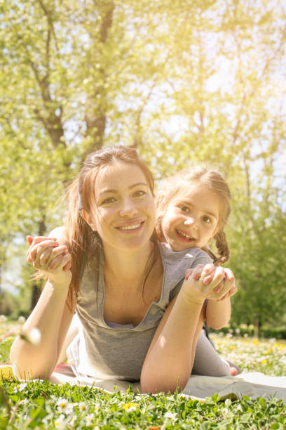 istock Mother and daughter on the meadow. 672909936