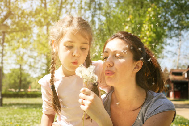 istock Mother and daughter in the meadow. 672910106