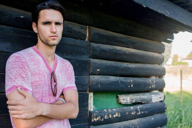 istock Young man with arms crossed looking at camera. 672916110