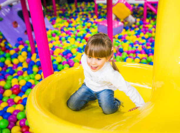 istock Little girl playing on playground 672916974