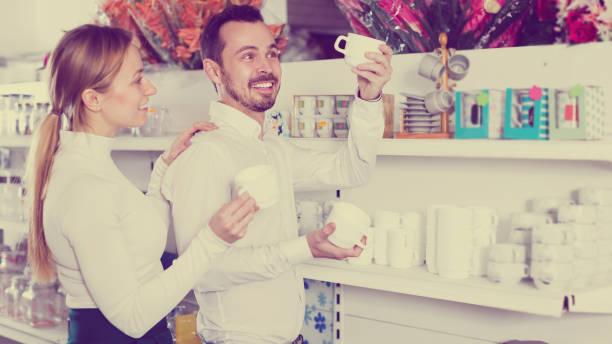 istock Couple selecting crockery in store 672919724