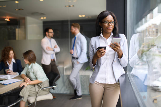 istock Young businesswoman using mobile in the office. 672920794