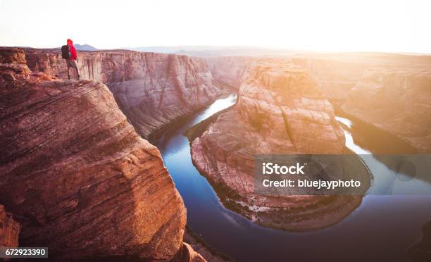 Male Hiker Overlooking Horseshoe Bend At Sunset Arizona Usa Stock Photo - Download Image Now