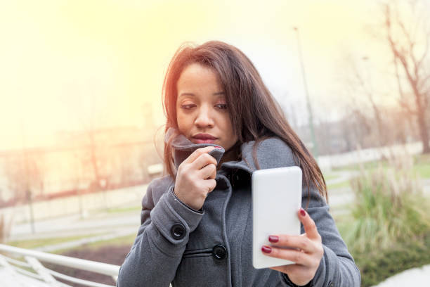 istock business woman chatting on mobile smart phone outside 672924554