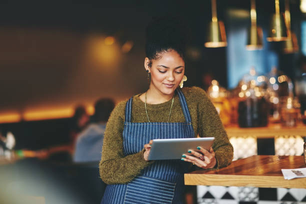 Putting her coffee shop on the social media map stock photo