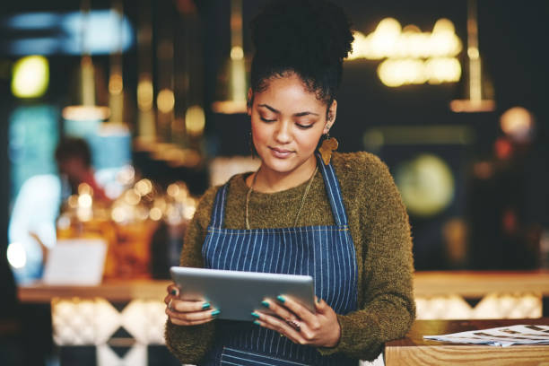 istock Managing her cafe the smart way 672924564
