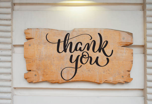 istock Blank wood board on wall and text Thank you. Calligraphy lettering hand draw 672933752