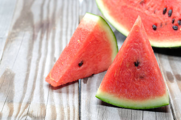 istock Watermelon slice on wooden. 672934808