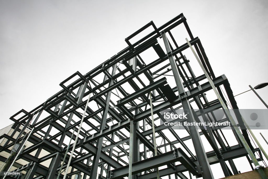 Construction Site Steel Frame Shot of steel frame made of rsjs on a construction site in cloudy weather Physical Structure Stock Photo