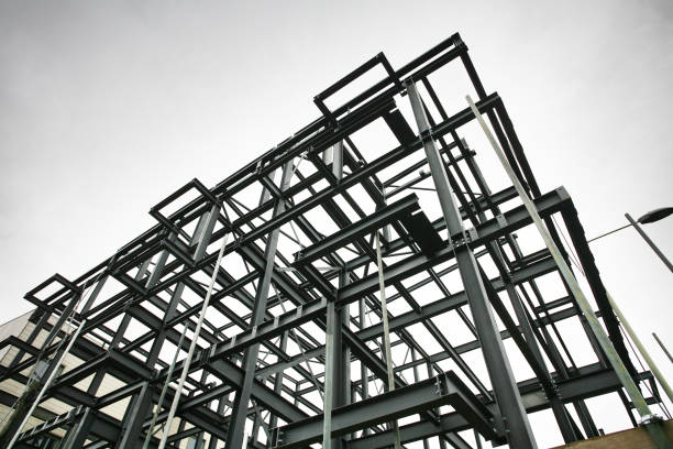 Construction Site Steel Frame Shot of steel frame made of rsjs on a construction site in cloudy weather girder photos stock pictures, royalty-free photos & images