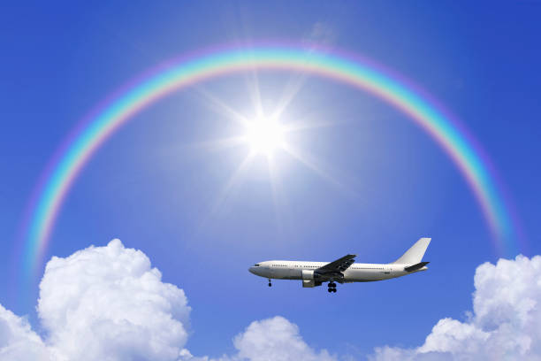 Light aircraft and towering cloud in summer and Rainbow