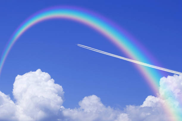 istock Contrail and towering cloud in summer and the Rainbow 672952192