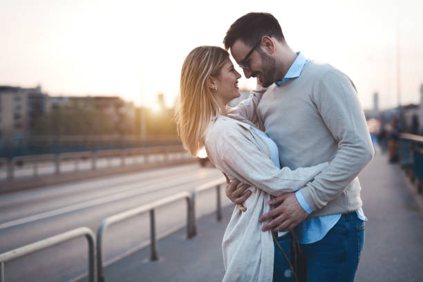 istock Happy romantic couple in love hugging and smiling 672956478