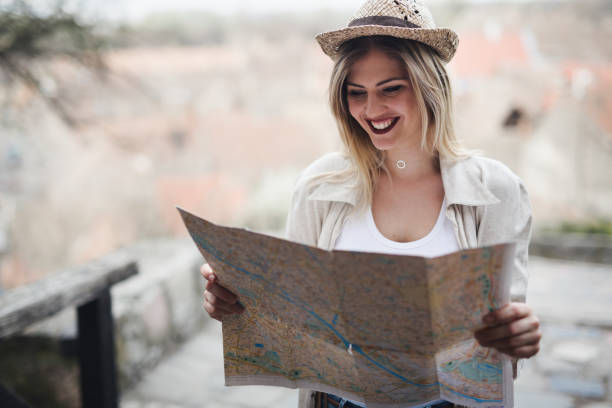istock Happy beautiful female tourist sightseeing and exploring 672957360