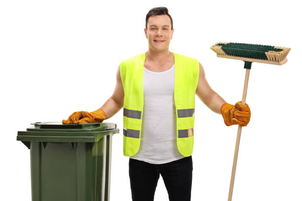 istock Waste collector with a garbage bin and a broom 672957364