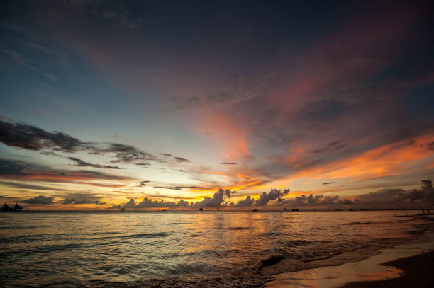 istock Beautiful sunset at Boracay beach, Philippines 672957512