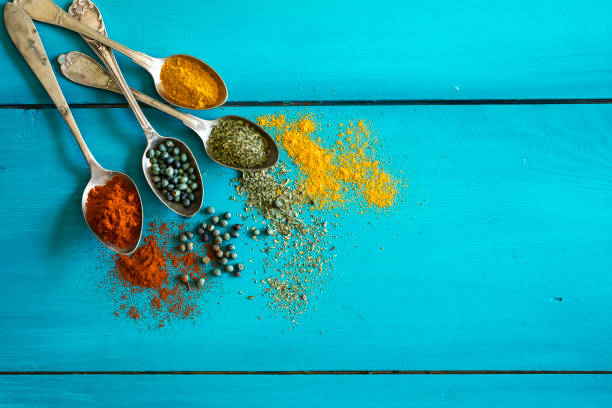 istock Spices and herbs on wooden background 672961236