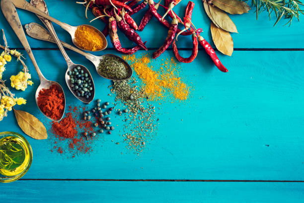 istock Spices and herbs on wooden background 672961240