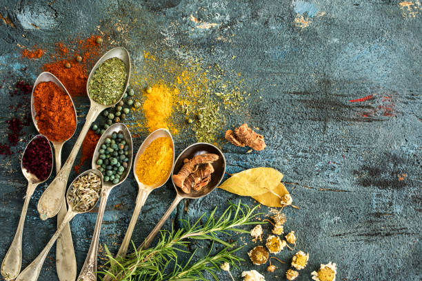 istock Spices and herbs on wooden background 672961242