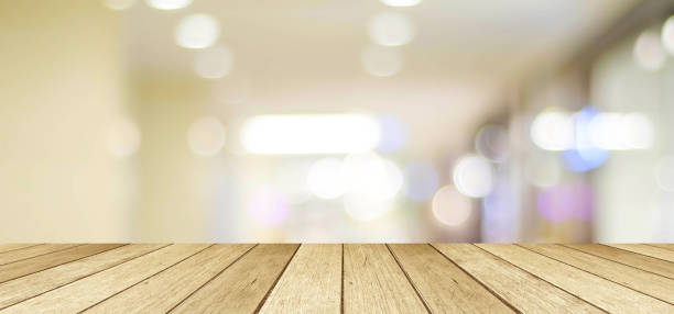 istock Empty table, perspective wood, over blurred store with bokeh background, product display montage background, banner 672961290