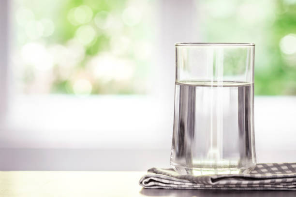 istock drink water from the bottle on table in living room 672961346