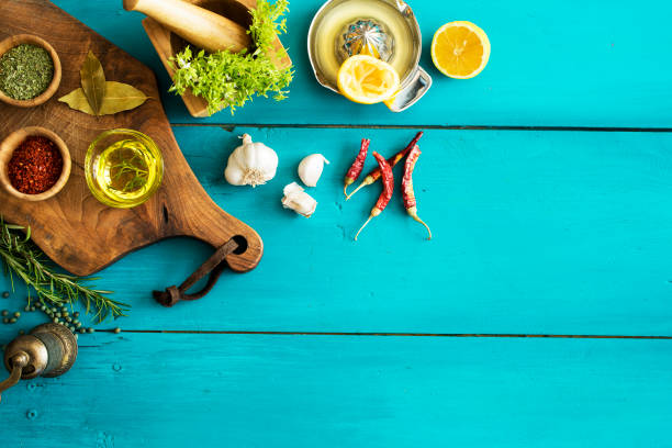istock Spices and herbs on wooden background 672962782