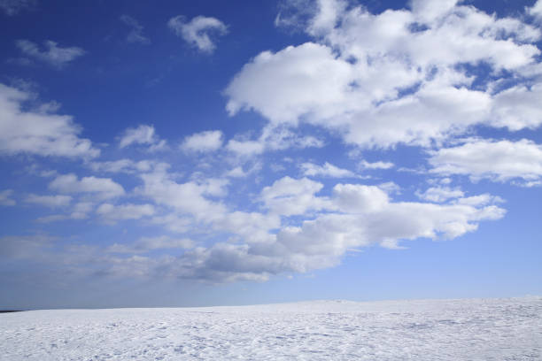 istock Snowy field and a blue sky 672963466