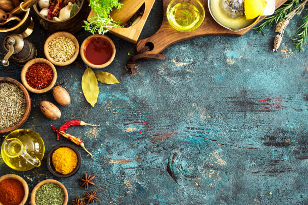 istock Spices and herbs on wooden background 672963506