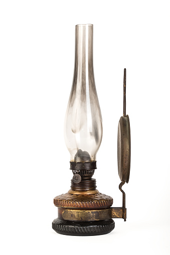 old kerosene lamp hanging on wall