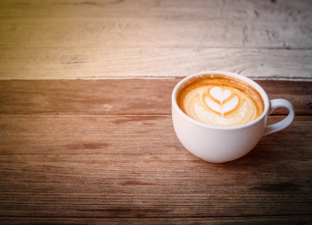 istock cup of coffee on wood table blackground 672969294