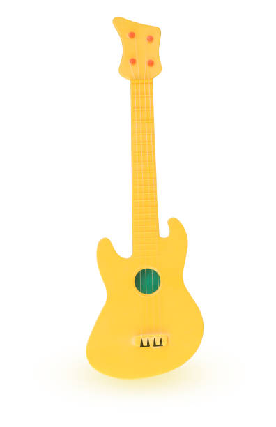 istock Yellow plastic toy guitar 672972446