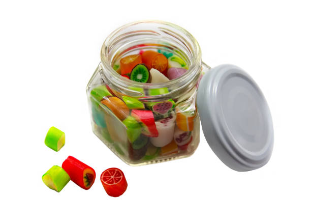 istock Colorful caramel in a glass jar 672978416