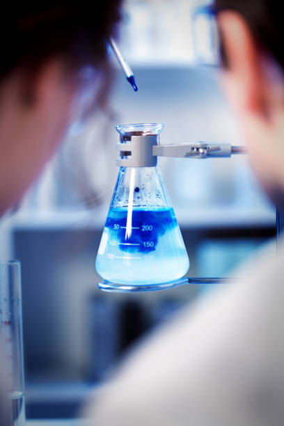 istock Two Scientists Chemist Working Together in a Laboratory in a Chemical Solution 672978842