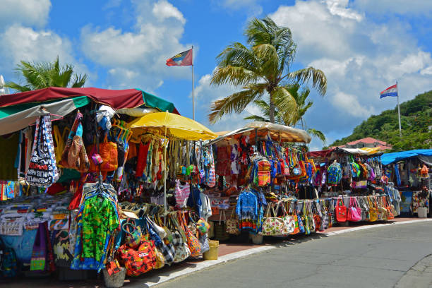 In the French capital of St Marin, a vibrant open air market arrives travelers in Marigot.