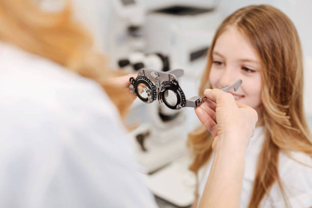 istock Clever competent doctor offering her patient glasses 672982128