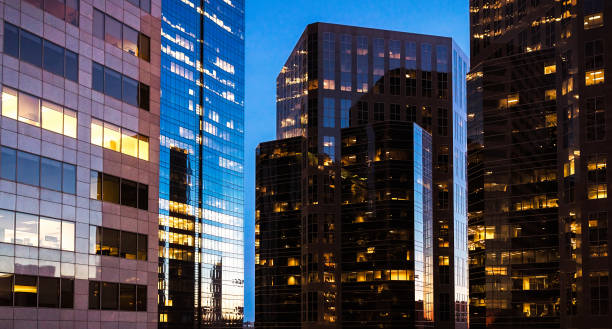 istock Modern city office towers at dusk 672993786