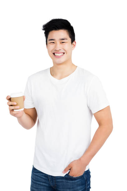 istock Happy man holding disposable coffee cup smiling at camera 673000376