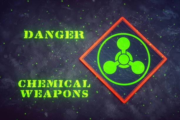 Glowing Chemical Weapons Sign A square sign featuring the international symbol for chemical weapons, with the glowing text "danger chemical weapons" besides it. biochemical weapon photos stock pictures, royalty-free photos & images