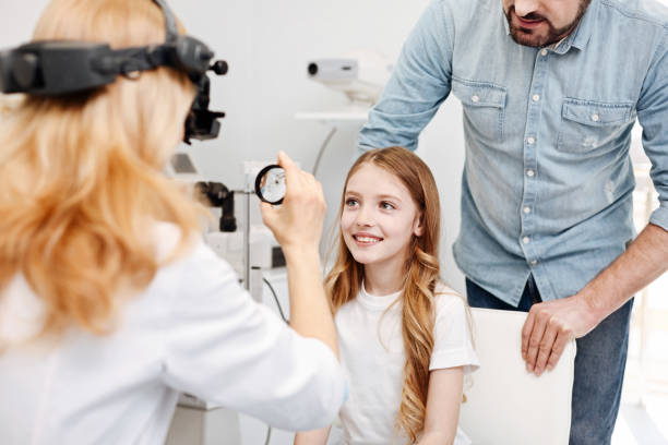 istock Excited young lady visiting doctor with her dad 673001114