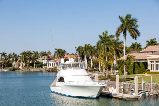 istock Fishing boat at a waterfront villa 673006296